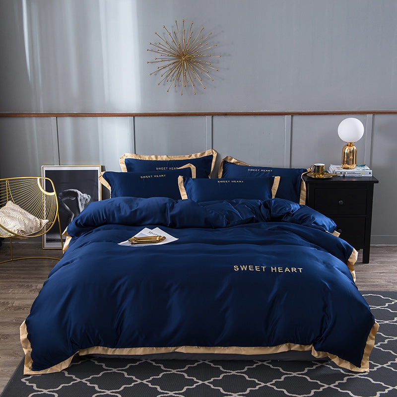 moregrowth101 Washed Silk Bed Sheet set in elegant navy with gold trim and embroidered details, adding luxury to your bedroom.