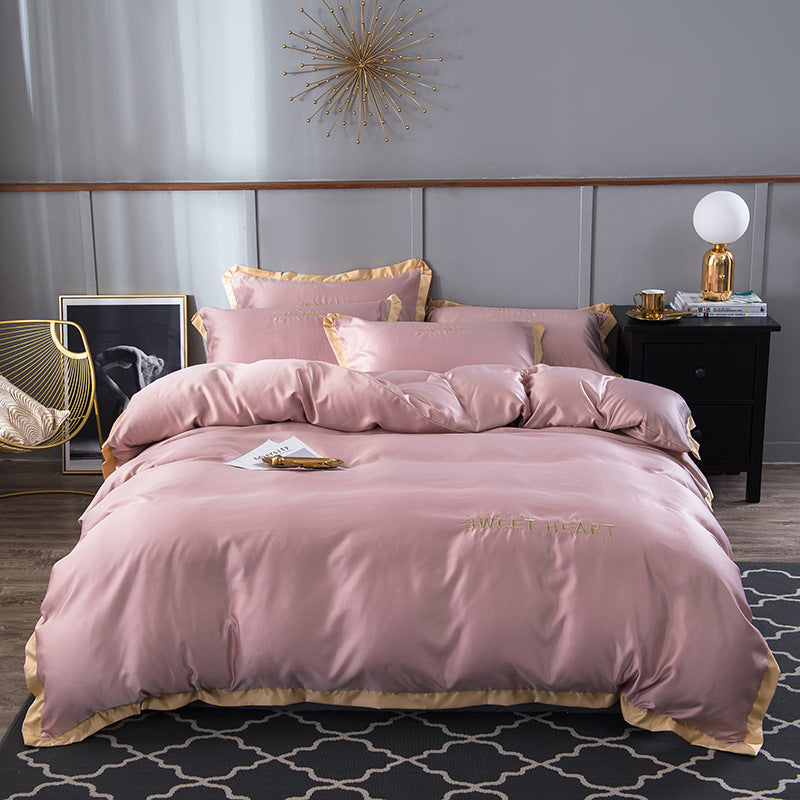 moregrowth101 Washed Silk Bed Sheet in pink with gold trim, luxury bedding for an elegant bedroom.