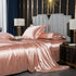 moregrowth101 washed silk four-piece bedding set in elegant blush color on a luxurious bed.