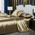 Washed Silk Four-Piece Bedding by moregrowth101 in gold color on a luxurious bed.