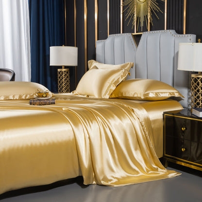 moregrowth101 Washed Silk Four-Piece Bedding Set in luxurious gold color, styled elegantly on a modern bed.