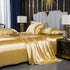 moregrowth101 Washed Silk Four-Piece Bedding Set in luxurious gold color, styled elegantly on a modern bed.