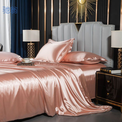 moregrowth101 Washed Silk Four-Piece Bedding Set in soft pink laid on a stylish bed with elegant decor.